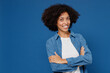 © ViDi Studio - Young smiling friendly cheerful satisfied happy black woman in casual clothes shirt white t-shirt hold hand crossed folded isolated on plain dark blue color background studio People lifestyle concept