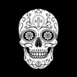 Decorative mexican sugar skull. Stylized skull. Day of the Dead. Stencil art. Sugar skull. Mexican skull. Black background.
