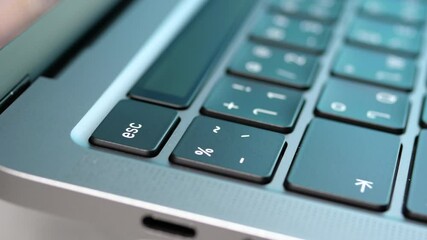 Wall Mural - Close up rotation movement of USB type c port for connection in laptop with blur Thai keyboard