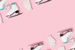 © Adela - Winter creative pattern made with retro skates and white mittens on pastel pink background. Retro aesthetic 80s or 90s trendy background. Minimal winter sports concept.
