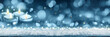 Christmas background with four blue burning Advent candles on white snow .
