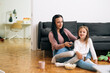 © cherryandbees - mother and daughter watching tv at home