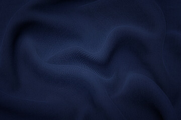 Close-up texture of natural blue fabric or cloth in same color. Fabric texture of natural cotton, silk or wool, or linen textile material. Blue canvas background.