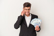 © Asier - Young business caucasian man holding banknotes isolated on white background covering ears with hands.