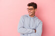 © Asier - Young caucasian man isolated on pink background smiling confident with crossed arms.