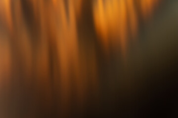 Wall Mural - defocused glow background. bokeh rays. solar blast effect. sun beam leak. blur golden orange black f