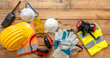 © Rawf8 - Work health and safety flat lay. Labor personal protective gear for industry and construction site.