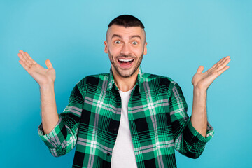 Wall Mural - Photo of amazed excited young man good mood news sale shopping hands raise isolated on blue color background