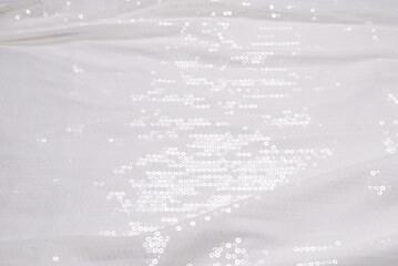  White sequin background. White shiny sequin fabric.