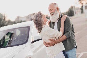 Wall Mural - Profile side photo of senior lovely couple hug embrace romantic trip vacation automobile vehicle rent road outdoors