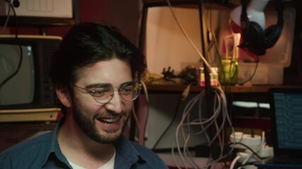 Gamer playing on laptop. Young happy man winning game. Professional gambling programmer infecting system with cyber virus, typing on computer keyboard, breaking password. 