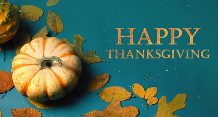 Wall Mural - Happy Thanksgiving pumpkin and blue background for holiday card greeting.