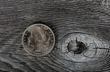 1921 Vintage Morgan Silver Dollar On Aged Wood Background