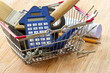 DIY tools and calculator in shopping basket, home construction and renovation costs concept