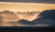 Fog burns off Kachemak Bay as seen from Homer, Alaska at sunrise. 
