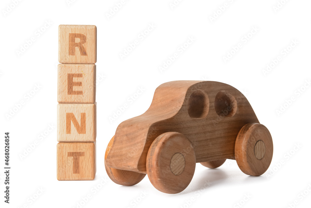 Wooden car and word RENT on white background