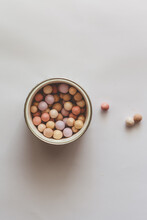 Overhead View Of A Pot Of Make-up Pearls On A Table