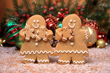 Family of Gingerbreads with 3 kids on Holiday Christmas Background