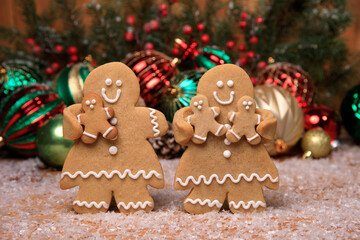 Wall Mural - Family of Gingerbreads with kids on Holiday Christmas Background