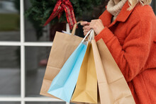 Close-up Of A Woman Carrying Shopping Bags At Christmas