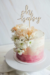 Sticker - Beautiful boho pastel cake with a topper and flowers on a white table