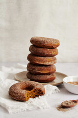 Canvas Print - Vertical shot of pumpkin donuts with Vanille sugar