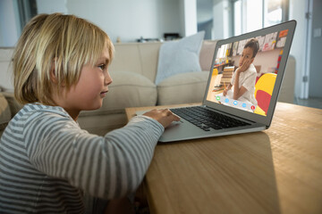 Poster - Caucasian boy using laptop for video call, with bored elementary school pupil on screen