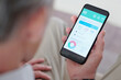© DragonImages - Close-up image of senior man checking micronutrient chart and consumed calories on smartphone