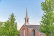 © Jason - Top exterior of a church in Utah with trees outdoors