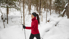 Winter Sport. Cross Country Skiing Classic Style Nordic Skiing In Forest. Woman In Winter Doing Fun Winter Sport Activity In The Snow On Cross Country Ski In Beautiful Nature Landscape