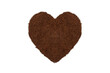Heaps of ground roasted coffee are arranged in a heart shape. isolated on a white background.
