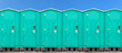 Portable mobile toilets in the park. A series of chemical toilets for holiday events. A green bio toilet cabin located in the city center. Toilet.