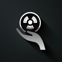 Silver Radioactive in hand icon isolated on black background. Radioactive toxic symbol. Radiation Hazard sign. Long shadow style. Vector