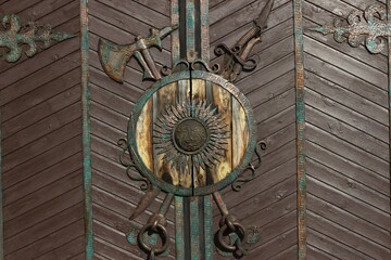 antique door with a forged coat of arms