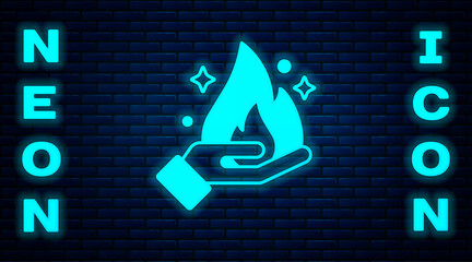 Poster - Glowing neon Hand holding a fire icon isolated on brick wall background. Vector