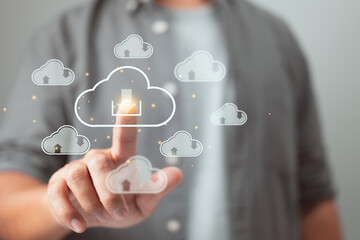 Leinwandbilder - The download cloud button is pressed by a man. Cloud computing is a method of storing and exchanging large amounts of data.