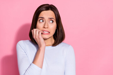 Sticker - Photo of scared unsure young lady dressed white jumper biting finger forget important thing looking empty space isolated pink color background