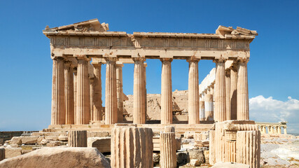 Fototapete - Parthenon temple on a bright day with blue sky. Panoramic image taken in Acropolis hill in Athens, Greece. Classical ancient Greek civilization landmark, famous place, panoramic travel background.
