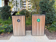 Separate waste and recycling bins in a clean public park