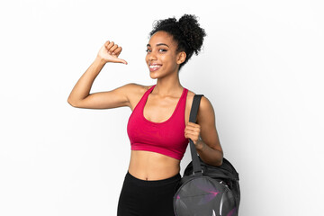 Wall Mural - Young sport african american woman with sport bag isolated on blue background proud and self-satisfied