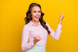 Photo of funky young brunette lady hands fists yell wear pink shirt isolated on yellow color background