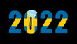 2022 with flag of Sweden and medical mask for protection against covid on black background