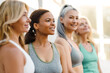 © Drobot Dean - Multiracial women talking and laughing after yoga practice
