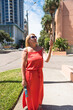 © kosoff - blonde on the street talking by video call