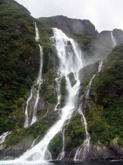 Poster - Milford Sound - Fiordland - New Zealand. the fiord's cliffs rise vertically from the dark waters