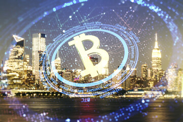 Double exposure of creative Bitcoin symbol hologram on Manhattan office buildings background. Mining and blockchain concept