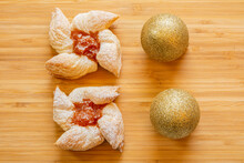 Joulutorttu, Traditional Finnish Christmas Pastry With Marmalade On The Wooden Board And Christmas Balls