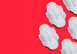 feminine sanitary pads on a red background