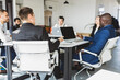 © xartproduction - Group of young business people in smart casual wear working together in office. Team at work.
