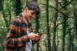 © carballo - adolescent male with mobile phone in autumn outdoors